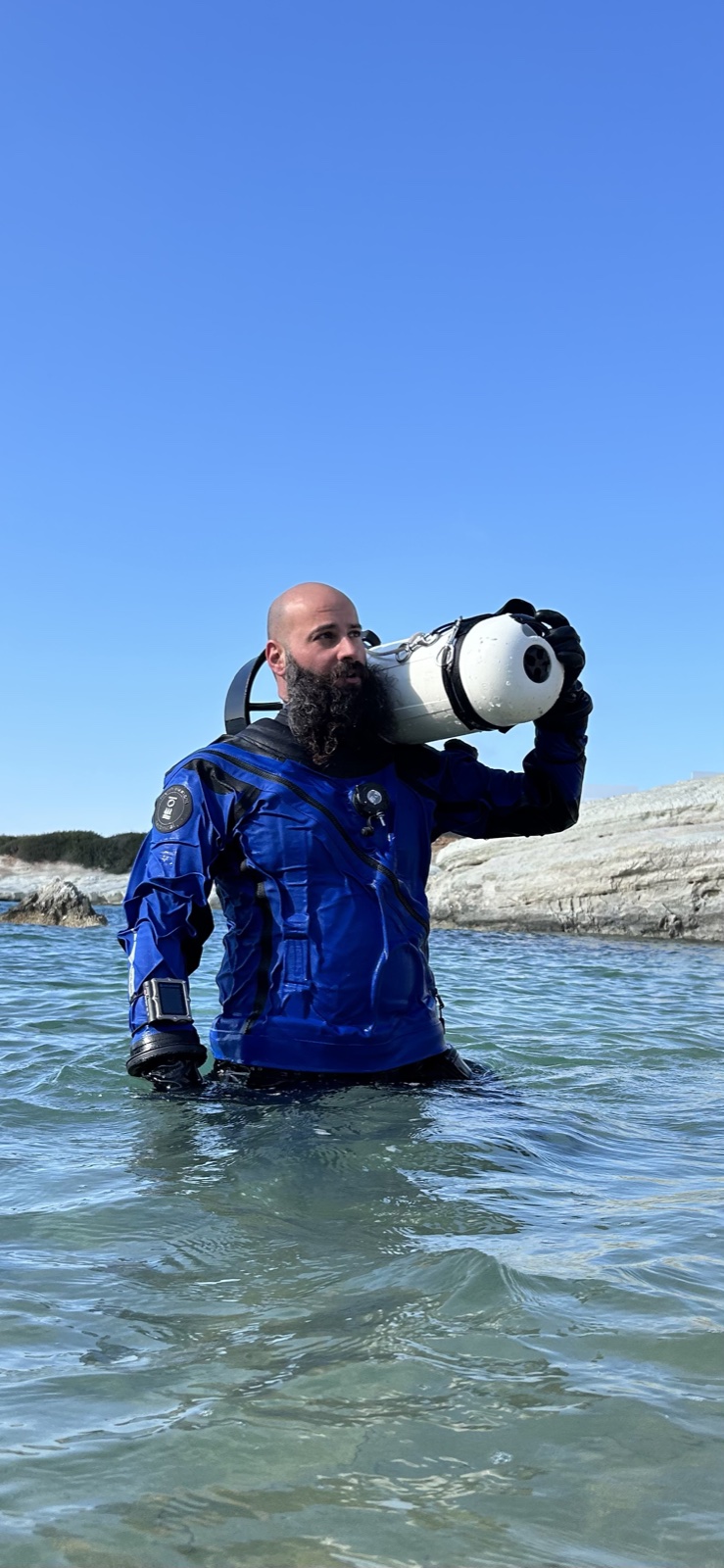 Imad Farhat GUE instructor portrait with SUEX DPV scooter on Cyprus beach