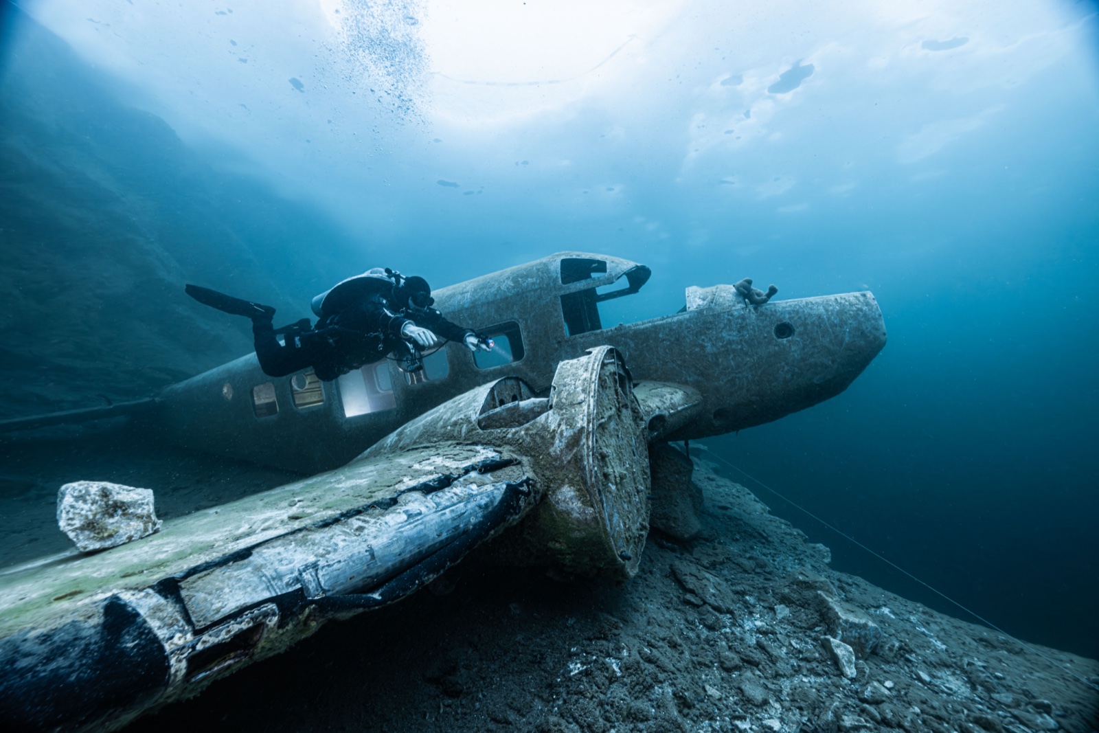 Tech diver inspecting sunken aircraft wreck at Flintkote Canada flooded quarry
